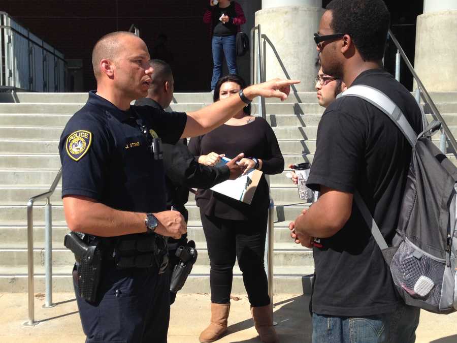 Officer J. Stone of the Campus Police department speaks with Umoja president Tony Givens about how to get in touch with officers during the Coffee With A Cop event March 12 in the BT/AH Quad. Photo credit: Angelica Wallingford
