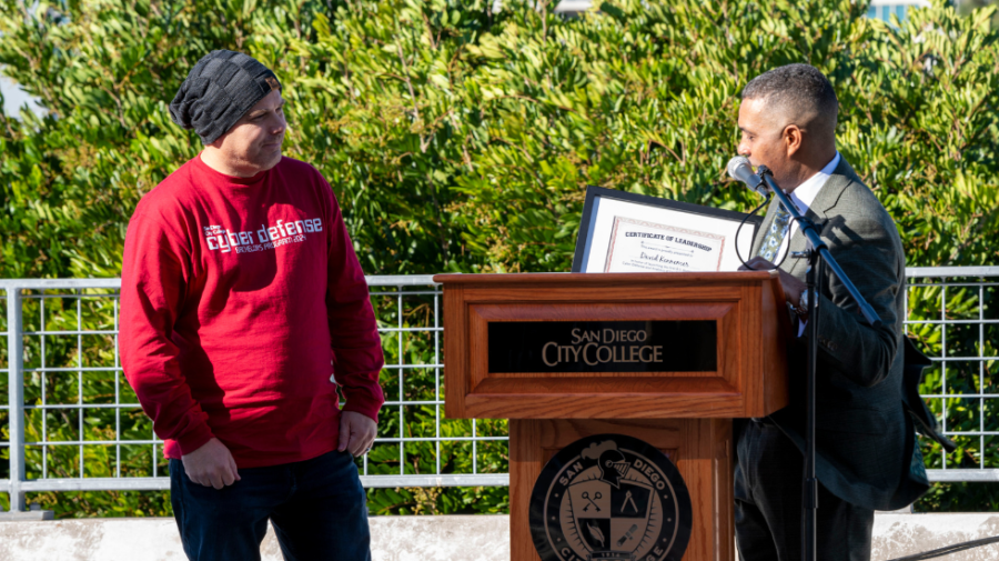 Professor David Kennemer (left), who spearheaded the cybersecurity bachelor's proposal, receives an award from City College President Ricky Shabazz at the 2023 Convocation. San Diego City College Flickr photo
