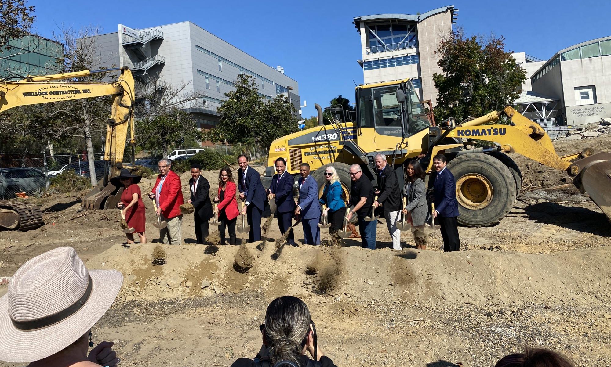 Members of the board of trustees and city officials join acting Community College District Chancellor Greg Smith, fifth from left, in striking the dirt during the groundbreaking ceremony at the site of San Diego City College’s future housing complex, Oct. 20, 2023. Photo by Luke Bradbury/City Times Media