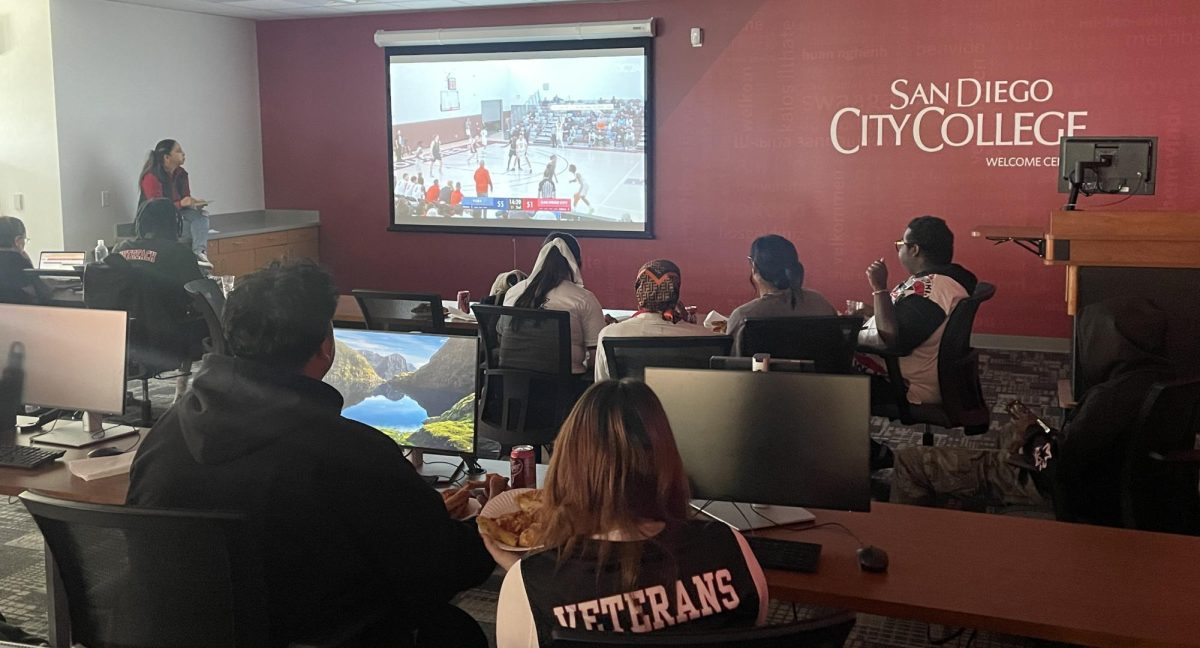 Members of the San Diego City College student outreach team watch City College’s Elite Eight matchup against Yuba College, played at Mt. San Antonio College, from the campus' Welcome Center, March 15, 2024. Photo by Danny Straus/City Times Media