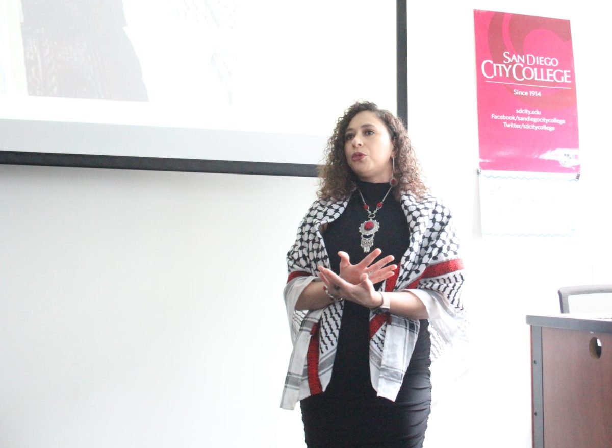 Artist Lorain Khalil Rihan explains her personal history at "Resistance through Art and Poetry," an artist talk hosted by the World Cultures program at San Diego City College, Wednesday, Mar. 6, 2024. Photo by Susana Serrano/City Times Media