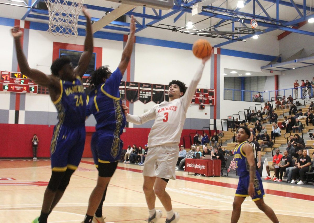 Al Green (3) goes up for a shot against a pair of Allan Hancock players in City's 64-61 overtime victory in the 2023 California Community College Athletic Association’s south region final at Harry West Gym, Saturday, March 9, 2024. Photo by Danny Straus/City Times Media