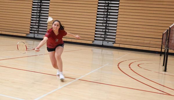 City College badminton player Dana Salas Sanchez reaches out for a shot against Mesa College at Harry West Gym, Wednesday, April 9, 2025. Photo by Danny Straus/City Times Media  
